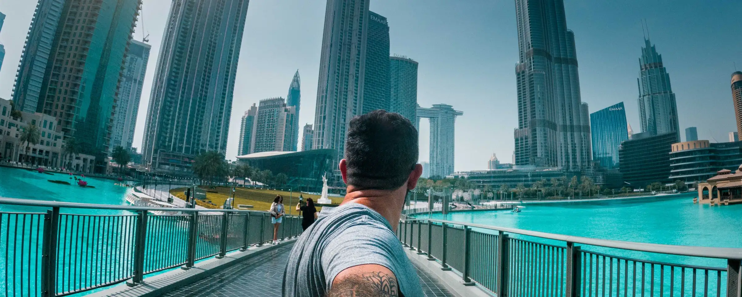 A man walking towards the Burj Khalifa in Downtown Dubai