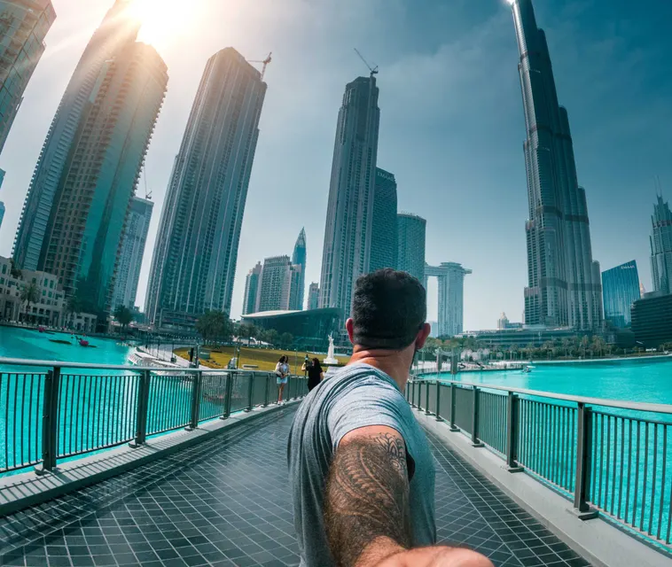A man walking towards the Burj Khalifa in Downtown Dubai